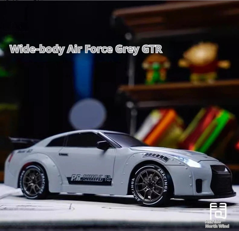 Model car with 'Wide-body Air Force Grey GTR' text on a blurred background